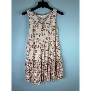 Rewind cream-colored sleeveless dress floral print crisscross neckline feminine